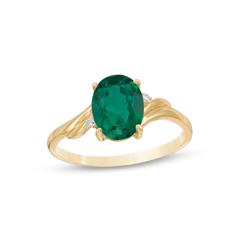 Obrączka zaręczynowa z 18-karatowego złota z owalnym szlifem i akcentem w postaci szmaragdu i diamentów-1