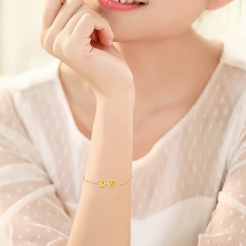 Pulsera con dije de lazo de oro de 10 quilates-2