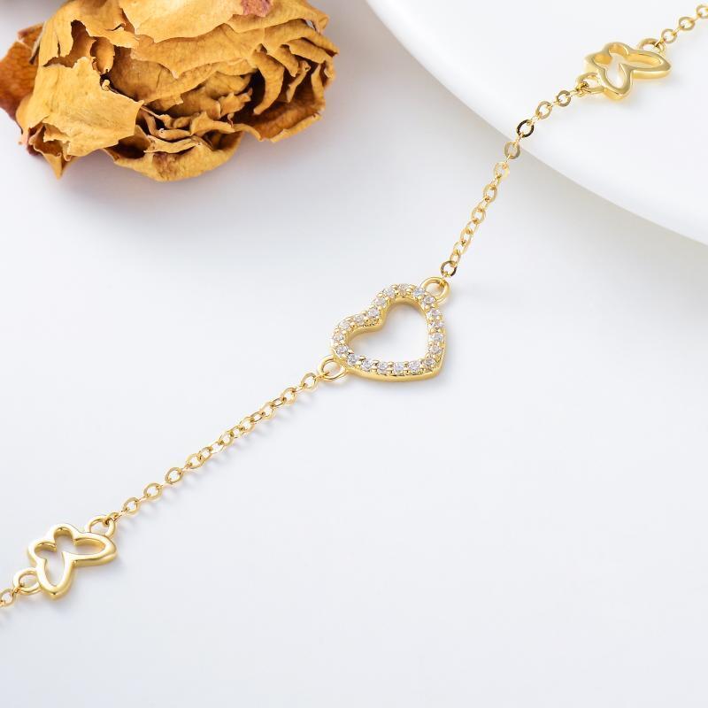 Pulsera con dije de mariposa y corazón de circonita cúbica en oro de 10 quilates-4