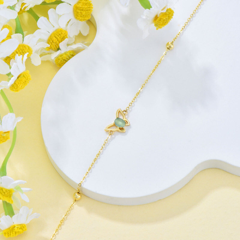 Armband aus 10-karätigem Gold mit Katzenaugenstein und Schmetterlingsanhänger-3