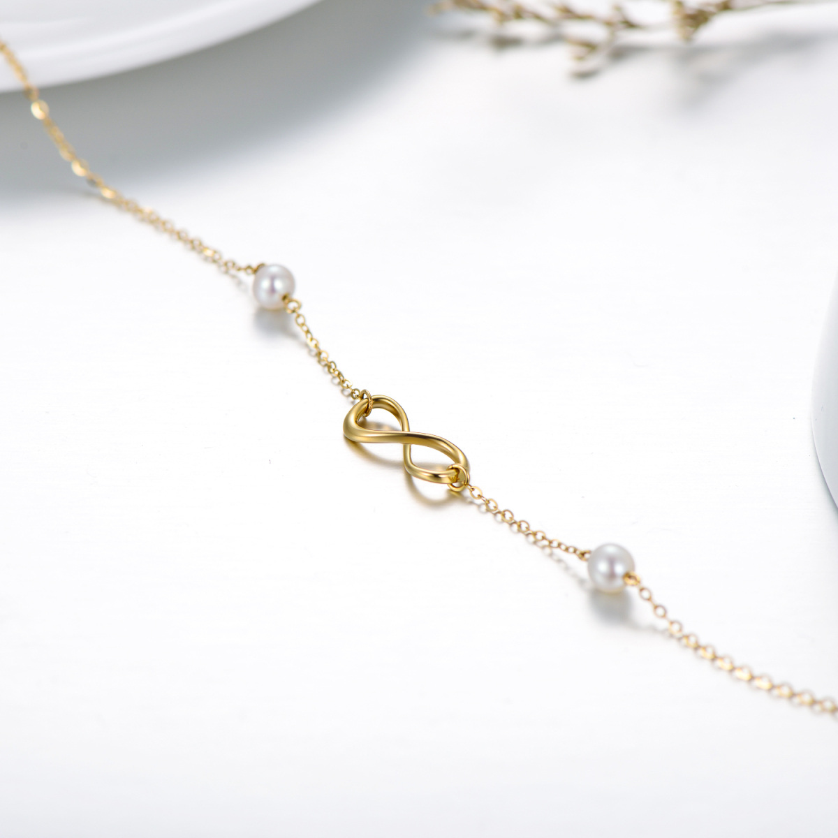 Pulseira com pingente de símbolo infinito de pérola em formato circular em ouro 14K-4