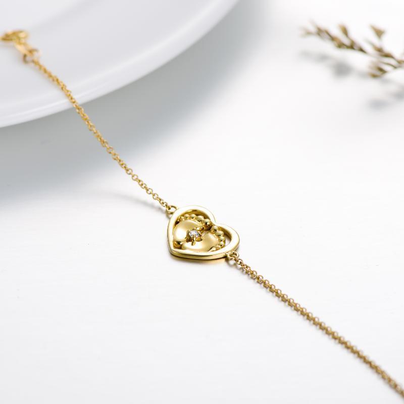 Pulsera de oro de 10 quilates con colgante de corazón y huellas de cristal-3