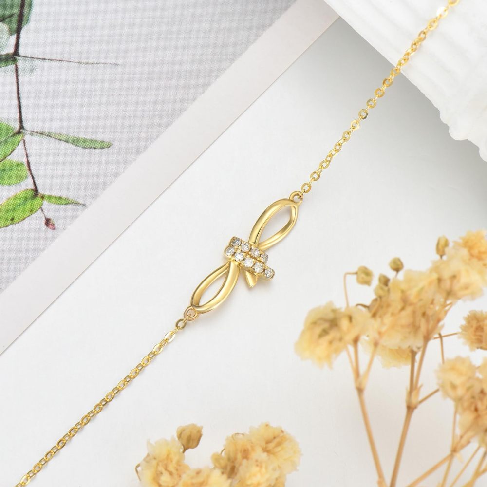 Pulseira com pingente de coração e laço de diamante em ouro 10K-5