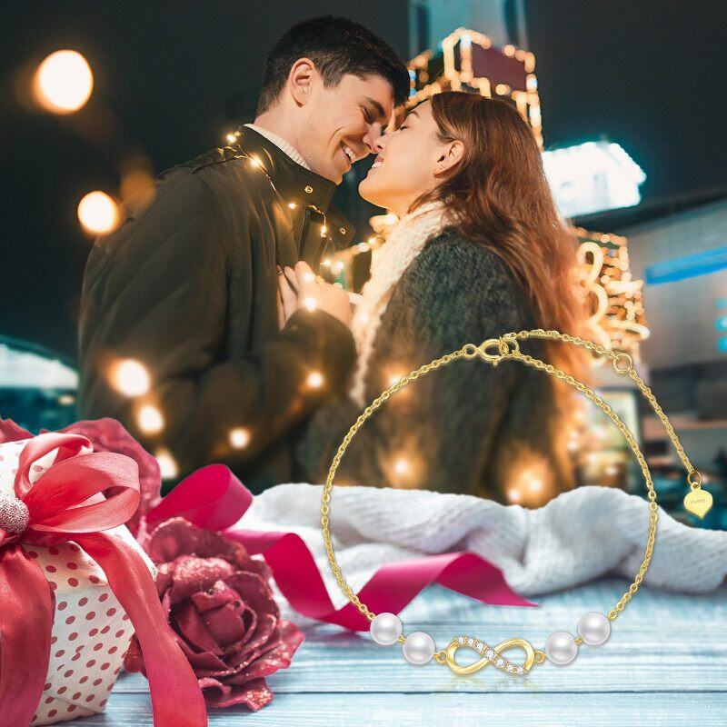 Pulseira de berloques com símbolo infinito e pérolas de diamante em ouro 10K-6