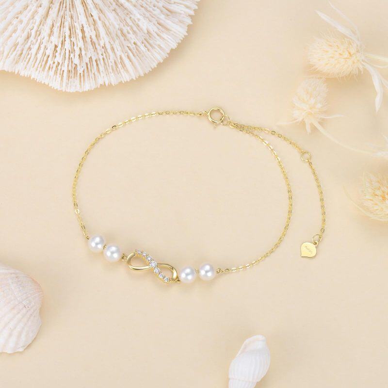 Pulseira de berloques com símbolo infinito e pérolas de diamante em ouro 10K-3