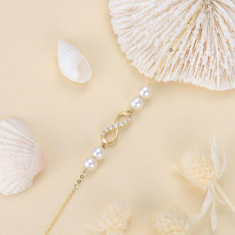 Pulseira de berloques com símbolo infinito e pérolas de diamante em ouro 10K-4