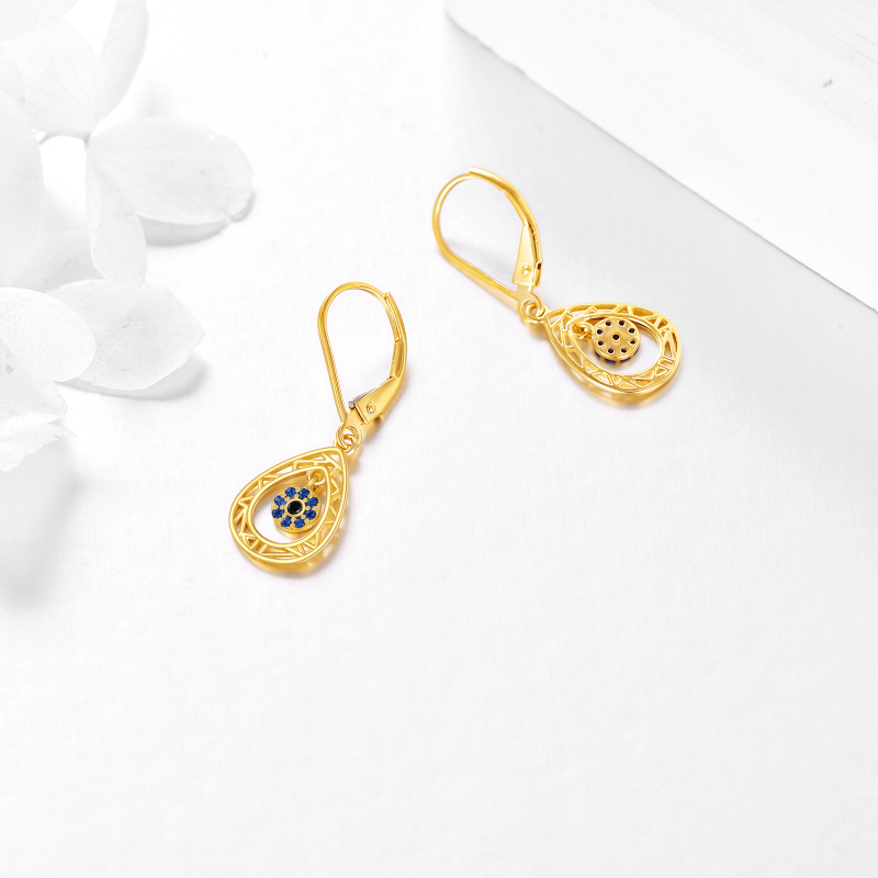 Brincos em ouro branco 10K com zircónias cúbicas em forma de gota e olho grego, com fecho de alavanca.-4
