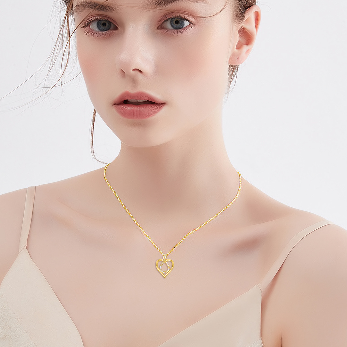 Collana con ciondolo a cuore e simbolo dell'infinito in oro 14K con zirconia cubica-2