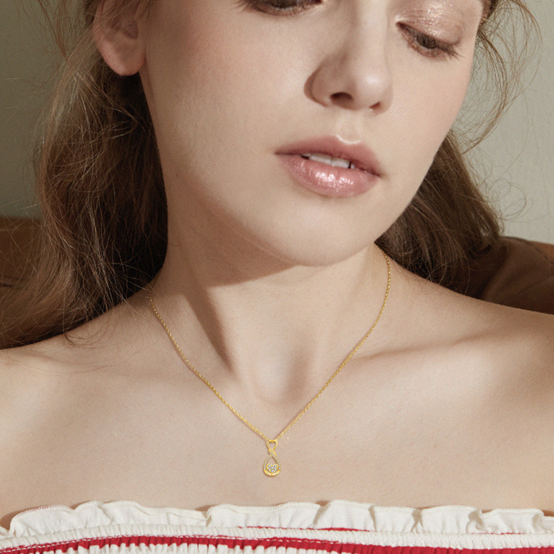 Collar con colgante de corazón y símbolo de infinito en oro de 18 quilates con circonitas cúbicas-2