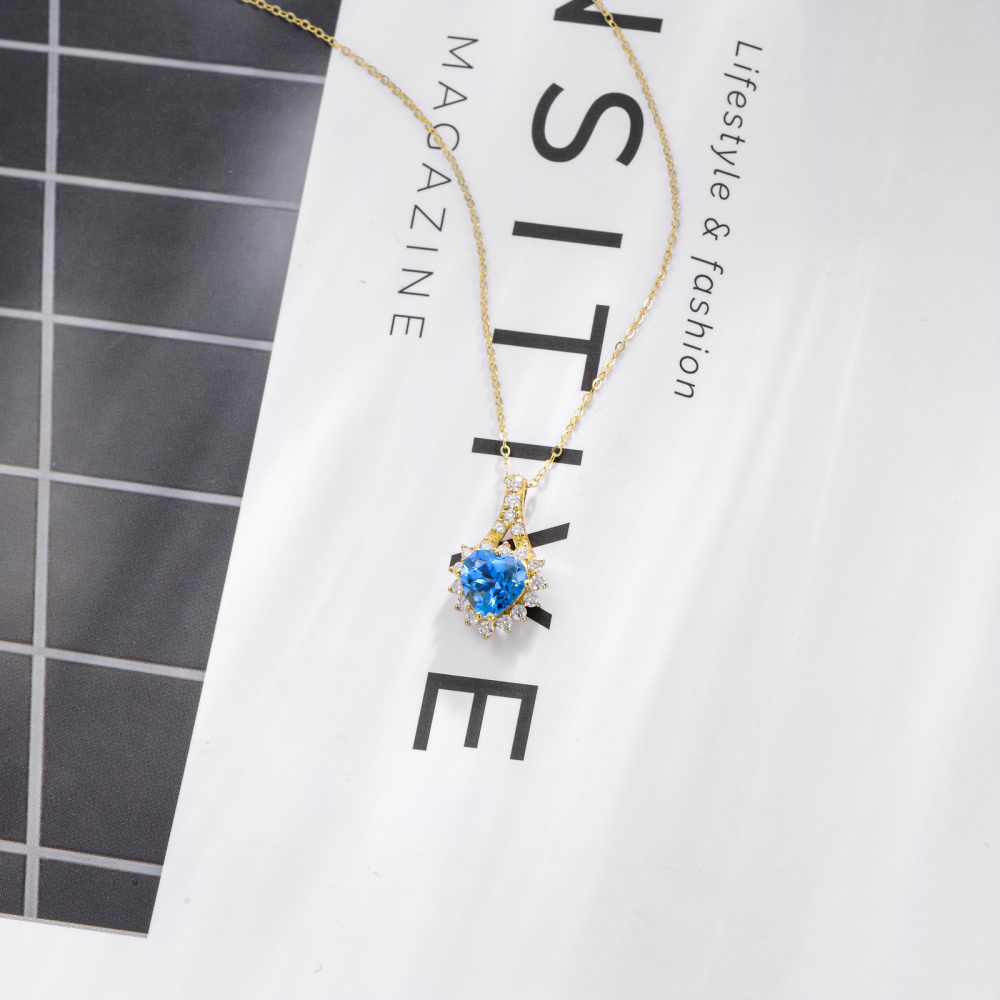 Halskette mit herzförmigem Halo-Topas-Tropfenanhänger aus 10 Karat Gold-4