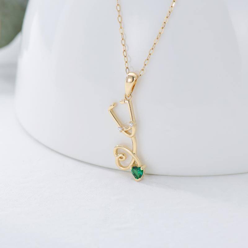 Colar com pendente de coração e estetoscópio em ouro 10K com zircónias cúbicas para mulher-3