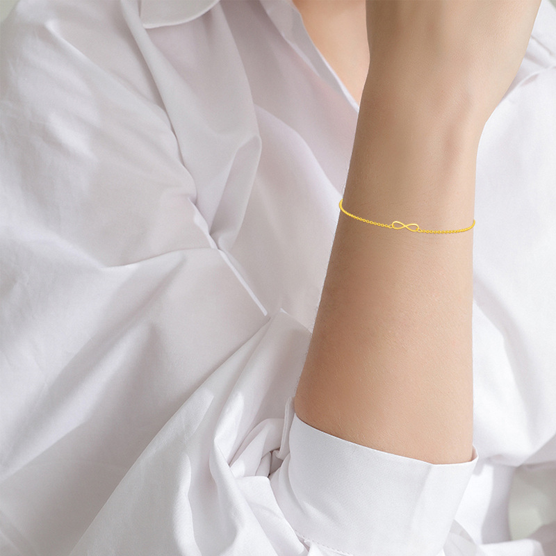 Bracciale con ciondolo simbolo dell'infinito in oro bianco 10K-2
