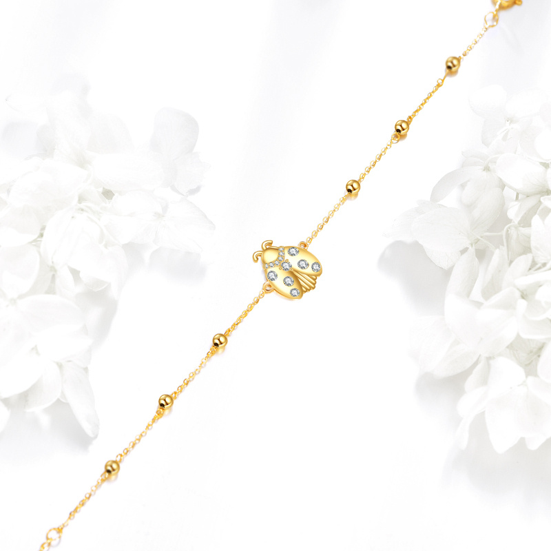 Pulsera con dije de mariquita de oro de 14 quilates y circonita cúbica-4