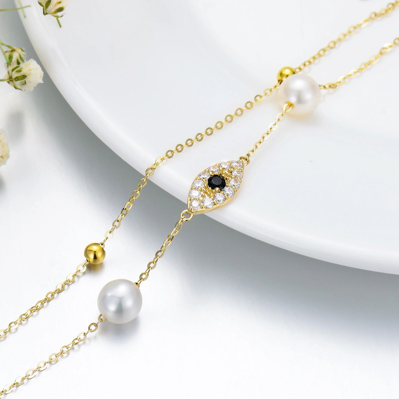 Tornozeleira multicamada em ouro 14K com pérola e olho de diabo-3