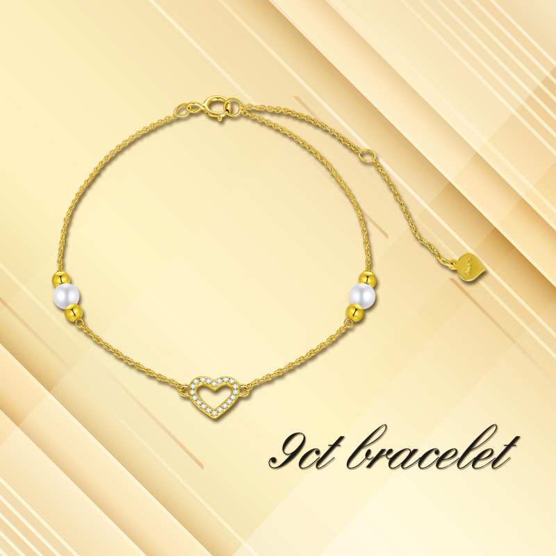 Pulseira com pendente coração em ouro branco 10K, zircónias cúbicas e pérola.-4