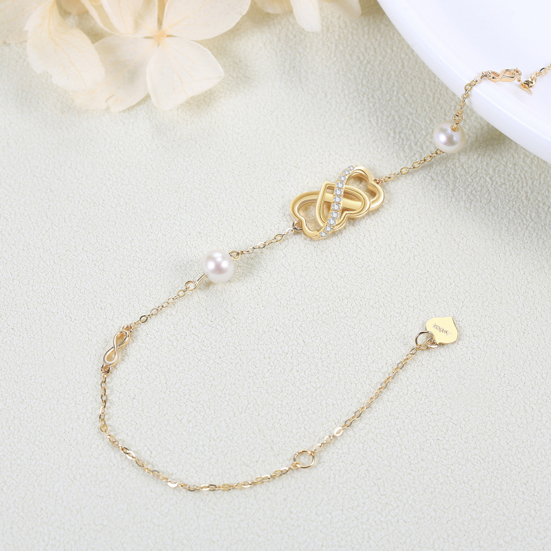 Pulsera con símbolo de infinito y corazón de perla en oro de 18 quilates para mujer-3