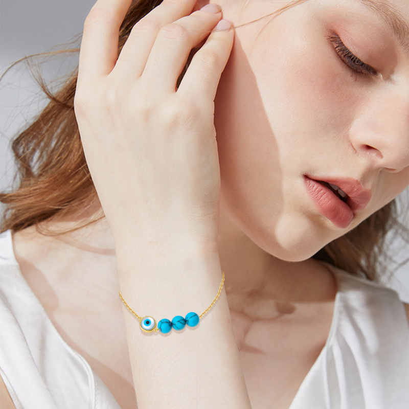 Bransoletka z zawieszką z turkusowym okiem ze złota 18K-2