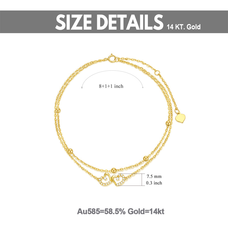 Tornozeleira com pendente de coração e zircónia cúbica de corte redondo em ouro branco de 10 quilates com várias camadas de pendentes de coração.-5