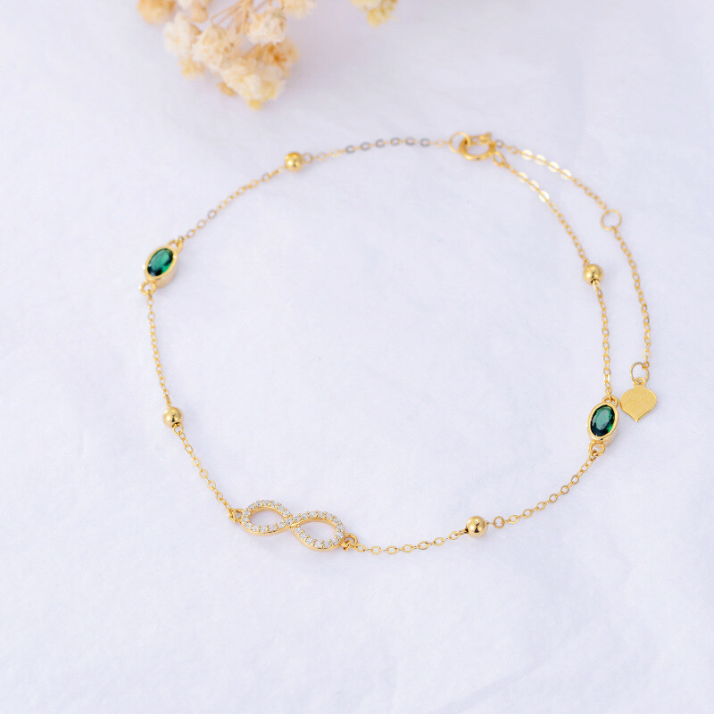 Tornozeleira com pendente de camada única em ouro 14K com zircónia cúbica e símbolo do infinito-2