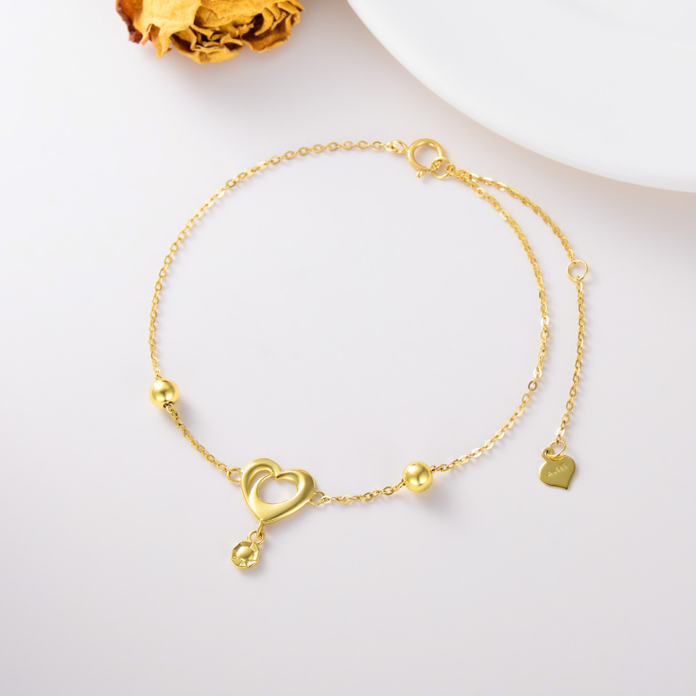 Pulsera con dije de corazón en oro de 14 quilates-2