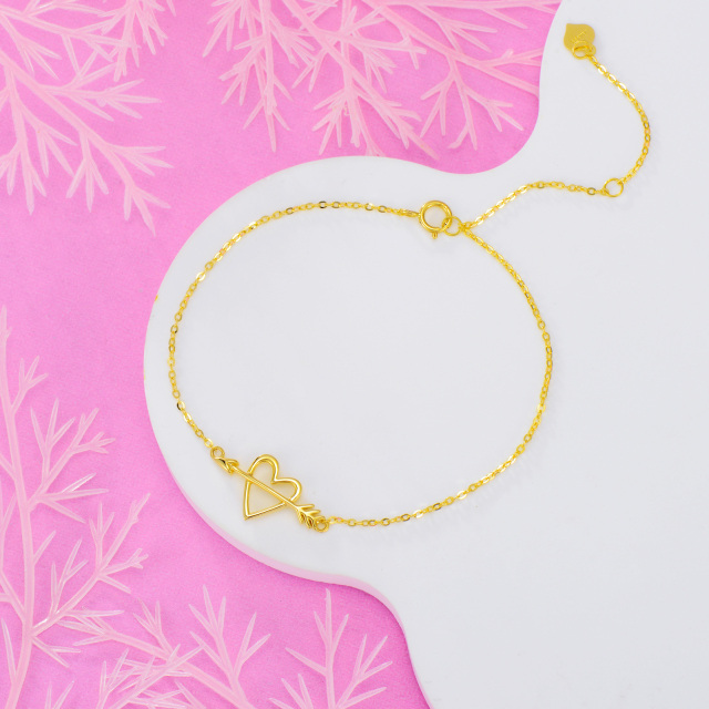 Pulsera de oro amarillo de 14 quilates con forma de corazón y flecha de Cupido-4