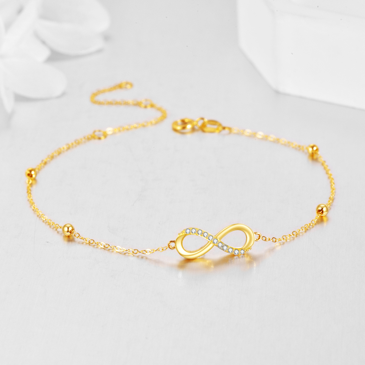 Pulsera con colgante de símbolo de infinito y circonita cúbica circular en oro amarillo de 14 quilates-4