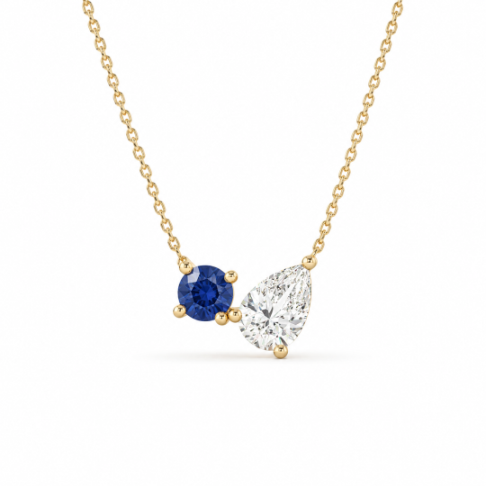Collar con diamante sintético de talla pera de 1 quilate y piedra natal de talla redonda en oro de 14 quilates.