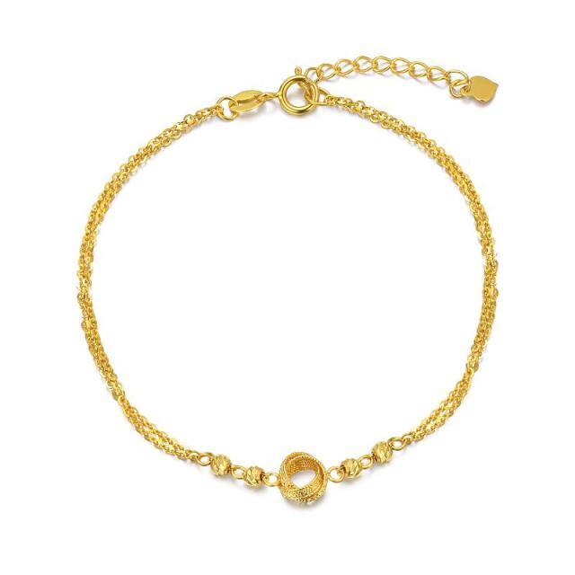 Bracelet superposé en or 18K avec perles et nœud celtique