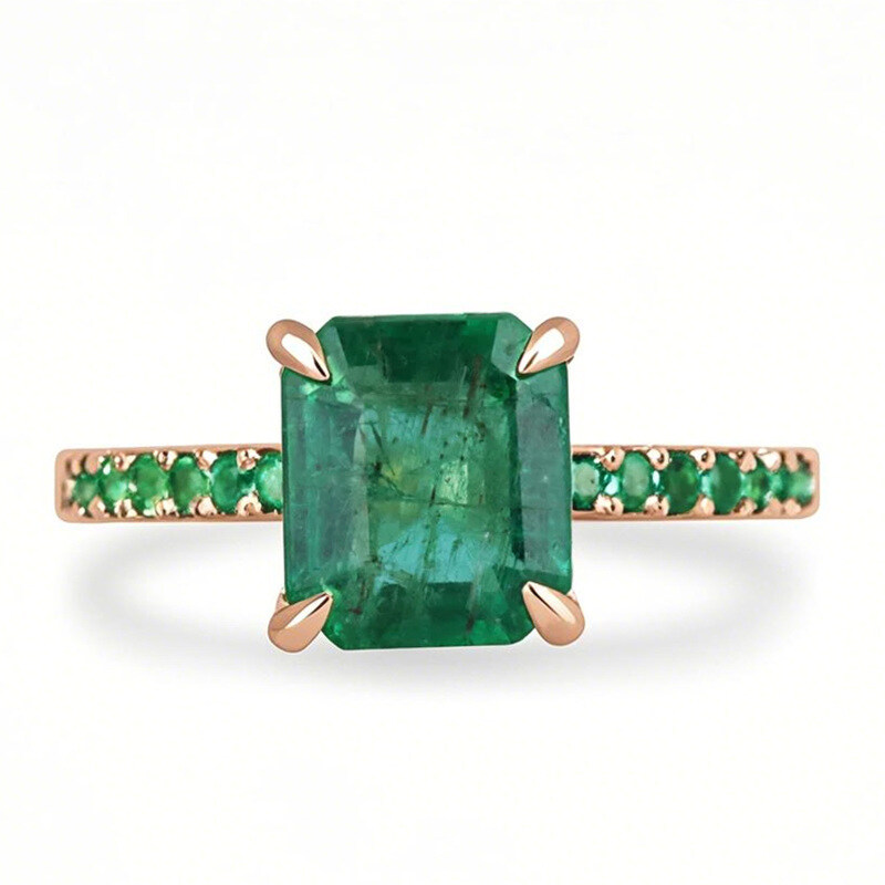 خاتم خطوبة من الذهب الوردي عيار 10 قيراط، بوزن يتراوح بين 1.4 و5.4 قيراط، مرصع بحجر زمرد كبير في المنتصف، مقطوع بالزمرد-1