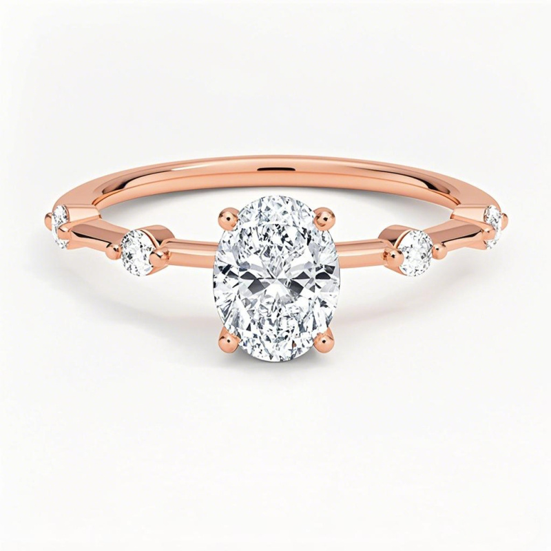 Obrączka zaręczynowa z 10-karatowego różowego złota o masie 0,6–3,1 ct. Szlif owalny, diament laboratoryjny, kolor D, czystość VVS-VS, certyfikat IGI-1