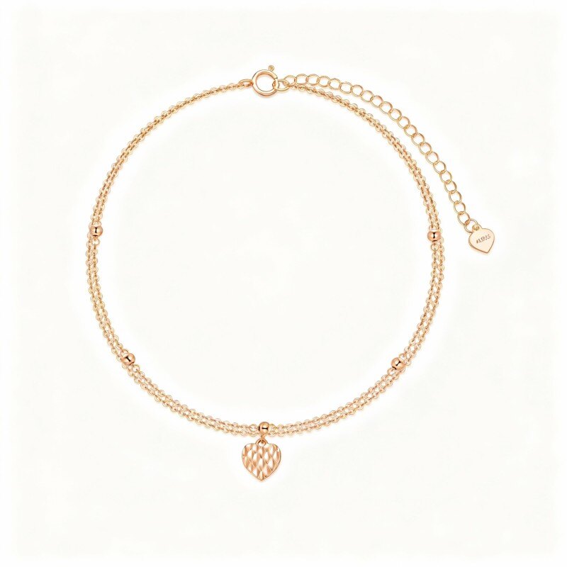Tobillera con dije de corazón multicapa en oro rosa de 14 quilates-1