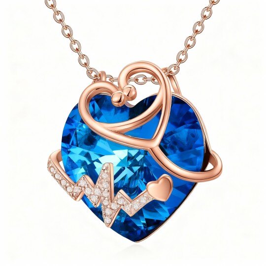 Colar com pendente coração e estetoscópio em ouro rosa 10K e cristais