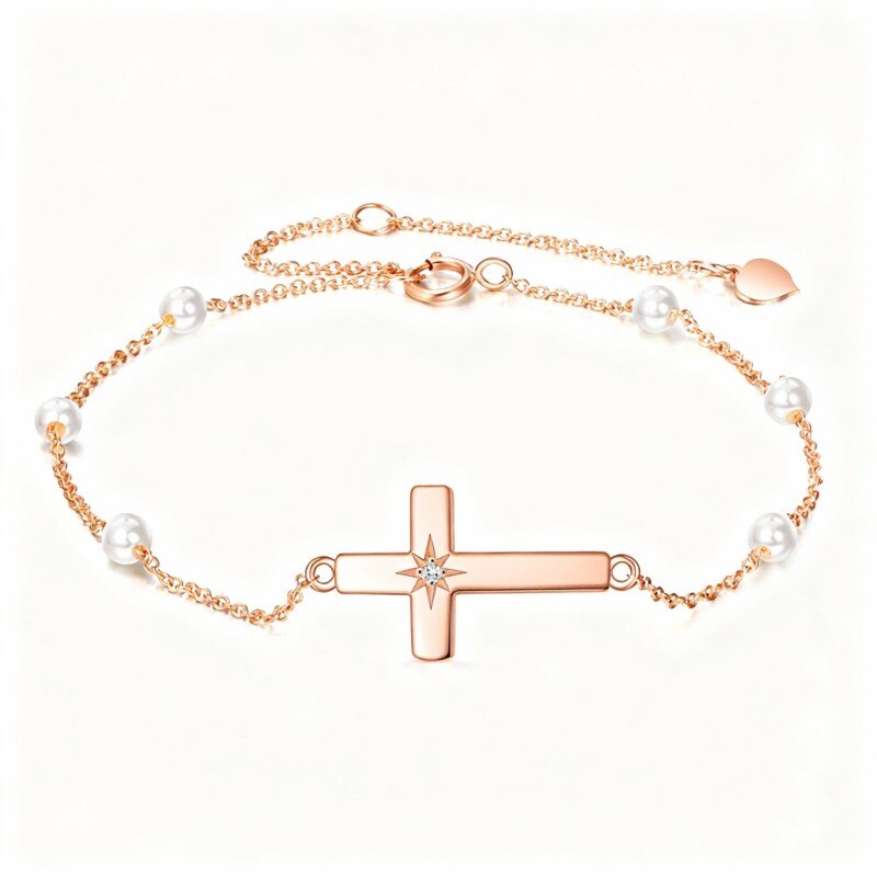 Bransoletka z zawieszką w kształcie krzyża z 10-karatowego różowego złota z moissanitem i perłą-1