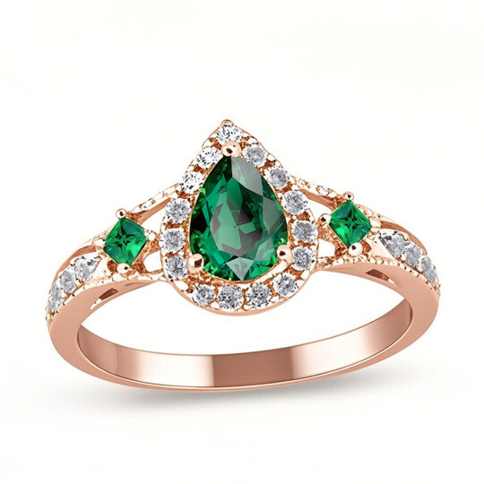 Anillo de compromiso de oro rosa de 10 quilates con halo de diamantes y esmeralda de talla pera