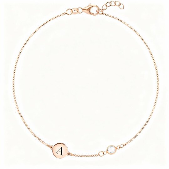 Pulsera de oro rosa de 10 quilates con circonita cúbica, piedra natal personalizada y dije con inicial personalizada.
