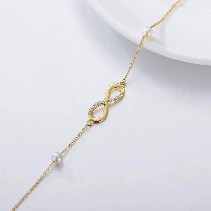 Tobillera con dije de una sola capa con símbolo del infinito y perla y diamantes en oro de 10 quilates-3
