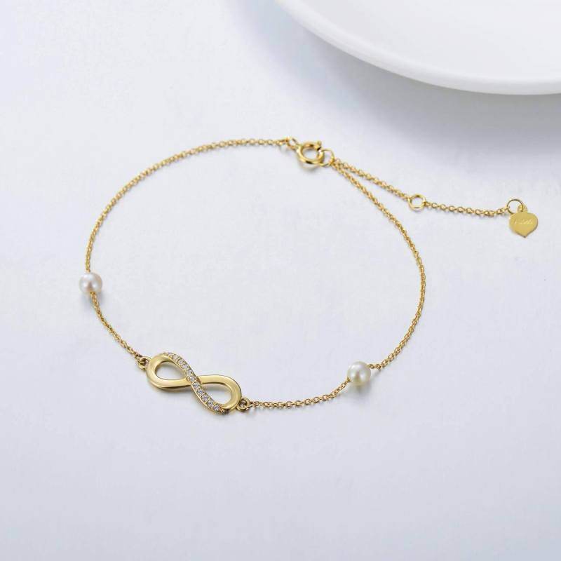 Tobillera con dije de una sola capa con símbolo del infinito y perla y diamantes en oro de 10 quilates-4