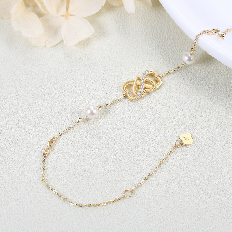 Pulsera con símbolo de infinito y corazón de perla en oro de 14 quilates para mujer-3