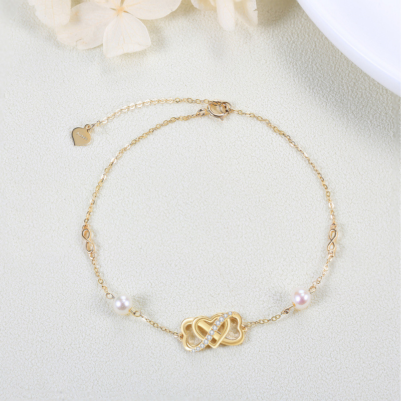 Pulsera con símbolo de infinito y corazón de perla en oro de 14 quilates para mujer-4