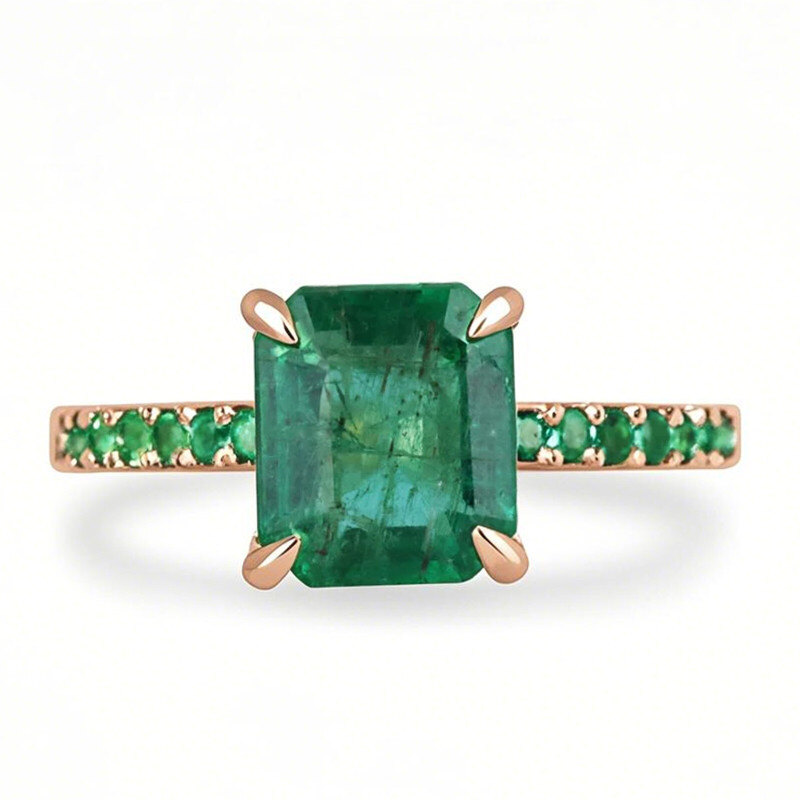 Anillo de compromiso de oro rosa de 10 quilates con moissanita de talla esmeralda y piedra lateral de esmeralda.-19
