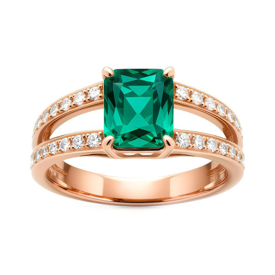 Cette exquise bague de fiançailles en or blanc 10K incarne une élégance intemporelle, avec une pierre centrale en forme d'émeraude brillante qui irradie sophistication et charme, parfaite pour la femme moderne qui valorise à la fois le luxe et l'artisanat.