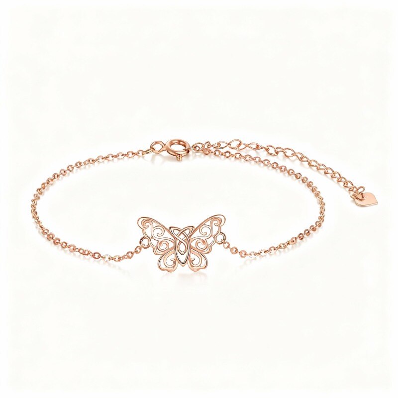 Pulsera con dije de mariposa y nudo celta en oro rosa de 18 quilates-1