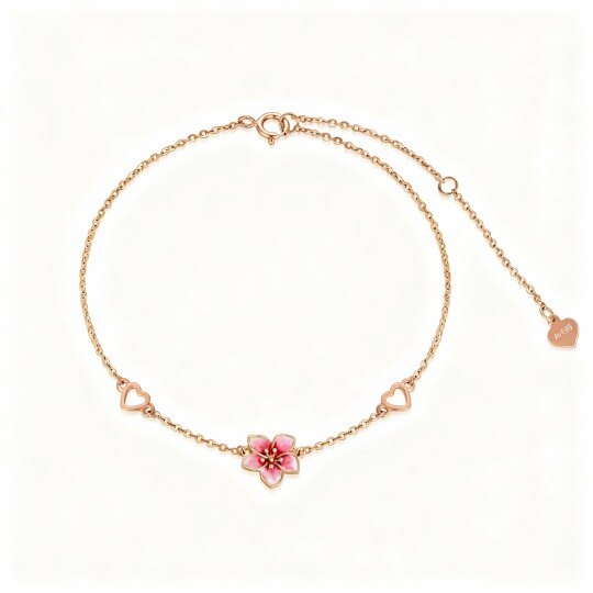 Pulseira com pendente de flor de cerejeira e coração em ouro rosa 10K