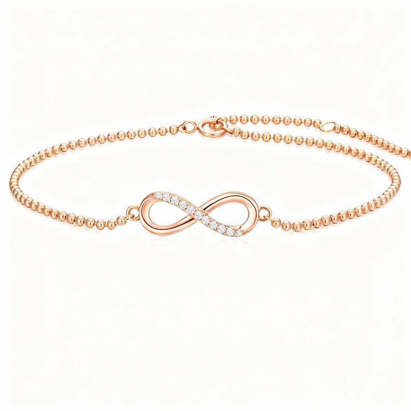 Bracelet à breloques en or rose 18 carats avec diamants et symbole de l'infini-1