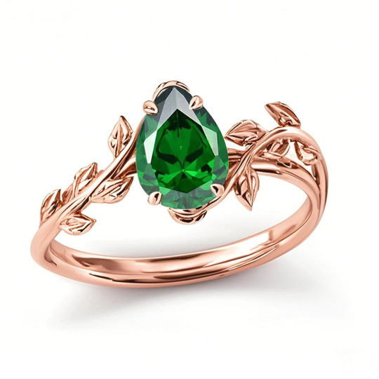 Anel de compromisso em ouro rosa 10K com esmeralda em forma de pera e folhas, ideal para aniversário ou casamento.