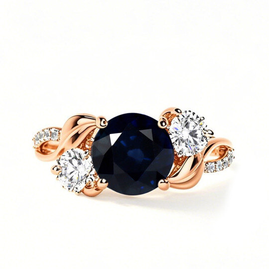 Anillo de compromiso de oro rosa de 10 quilates con zafiro de talla redonda.
