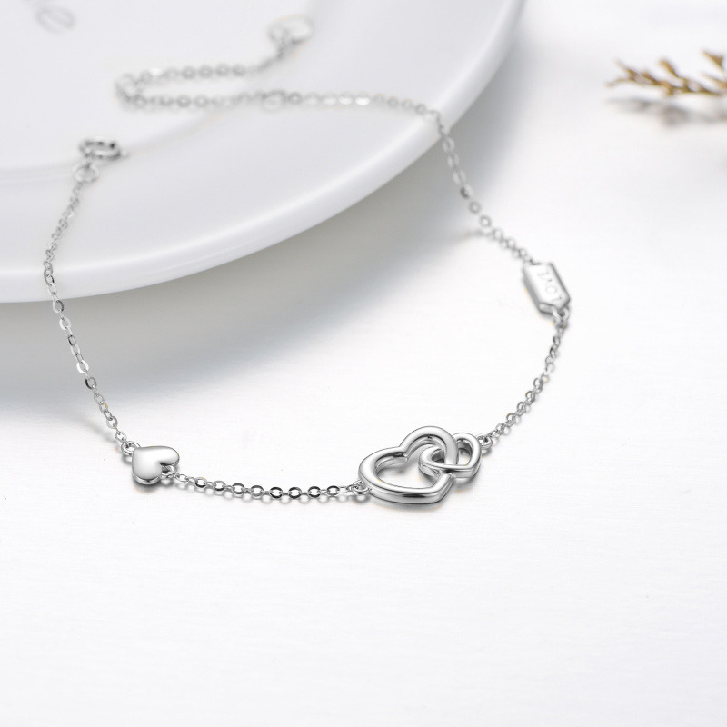 Pulsera de oro blanco de 14 quilates con dije de corazones entrelazados y palabra grabada para mujer-3