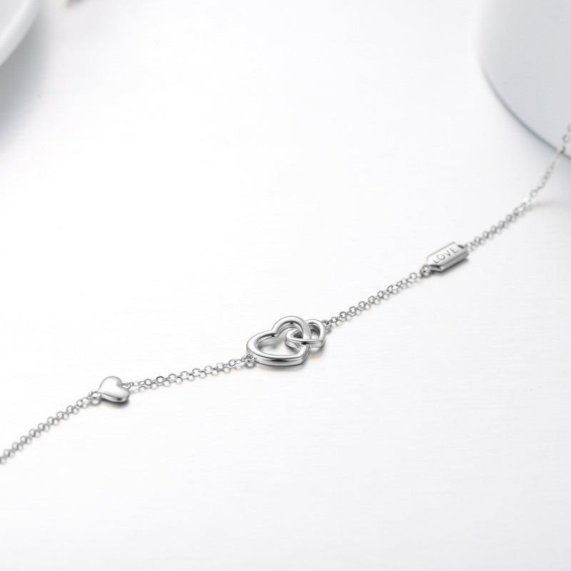 Pulsera de oro blanco de 14 quilates con dije de corazones entrelazados y palabra grabada para mujer-4