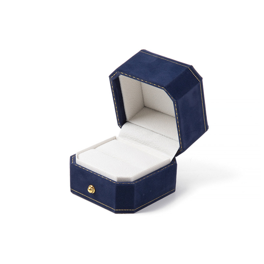 Joyero octogonal de terciopelo con borde dorado y hebilla dorada. Caja para anillos azul.