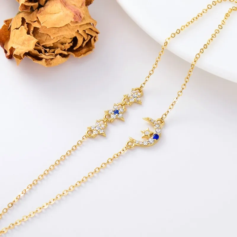 Tobillera con dije multicapa de luna y estrella de circonita en oro de 14 quilates-3